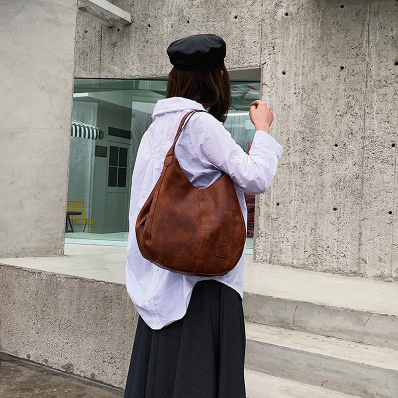 【🎊2025】Uued tooted】👜Naiste vanaaegsed pehmest nahast suure mahuga õlakotid-EE