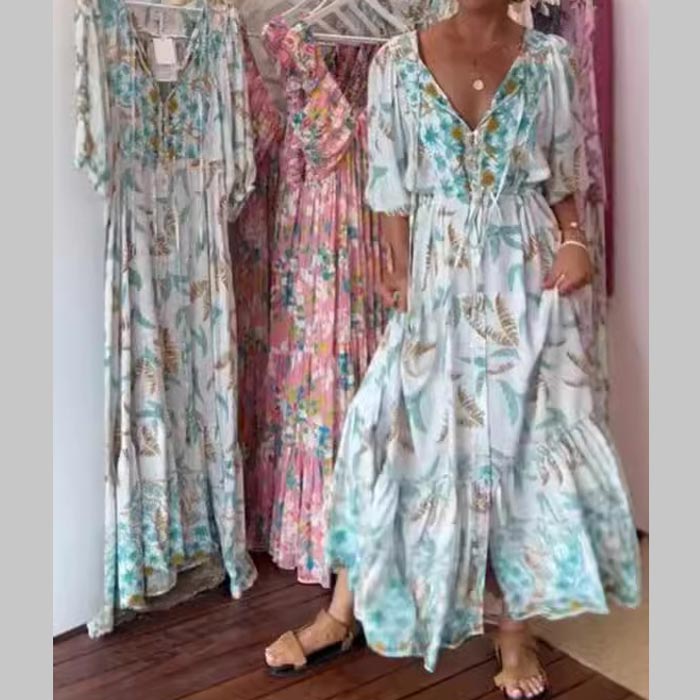 Vestido largo moderno de mujer con cinturón y escote.-ES