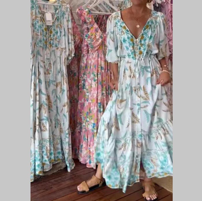 Vestido largo moderno de mujer con cinturón y escote.-ES